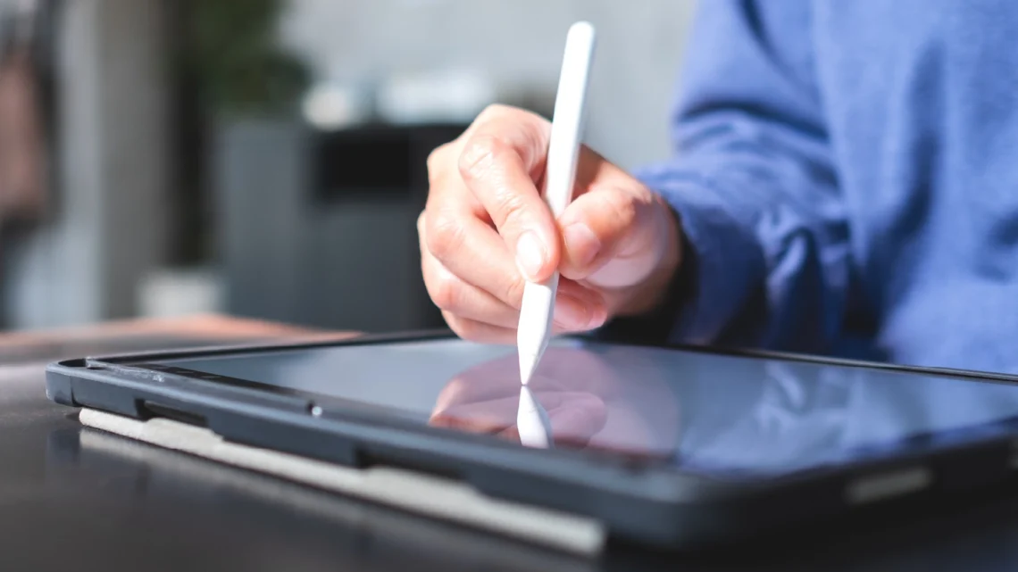 Person reviewing a printed last will and testament document on a tablet and legal papers in South Africa